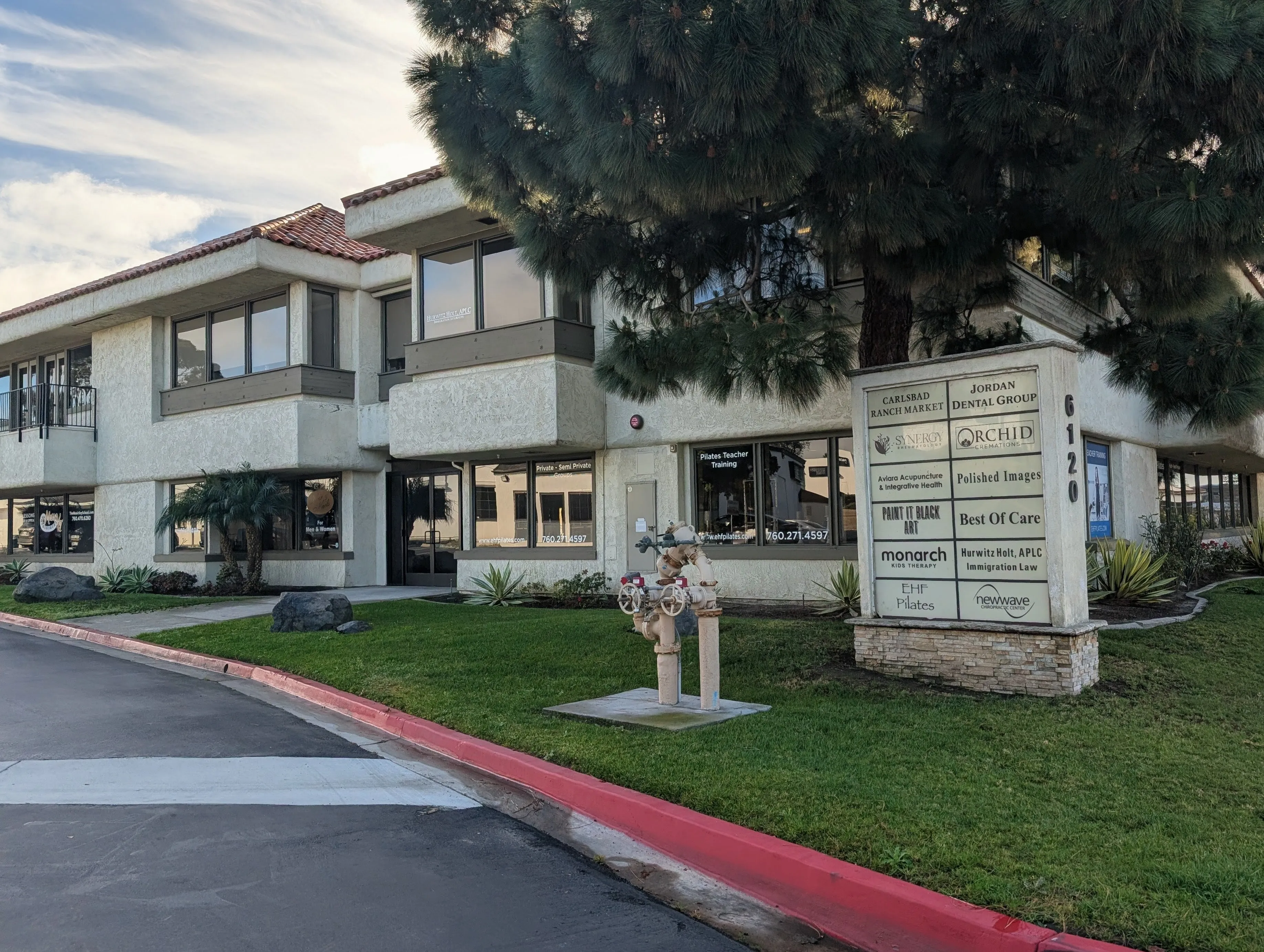 6120 Paseo Del Norte building with tenant directory showing Synergy Rheumatology